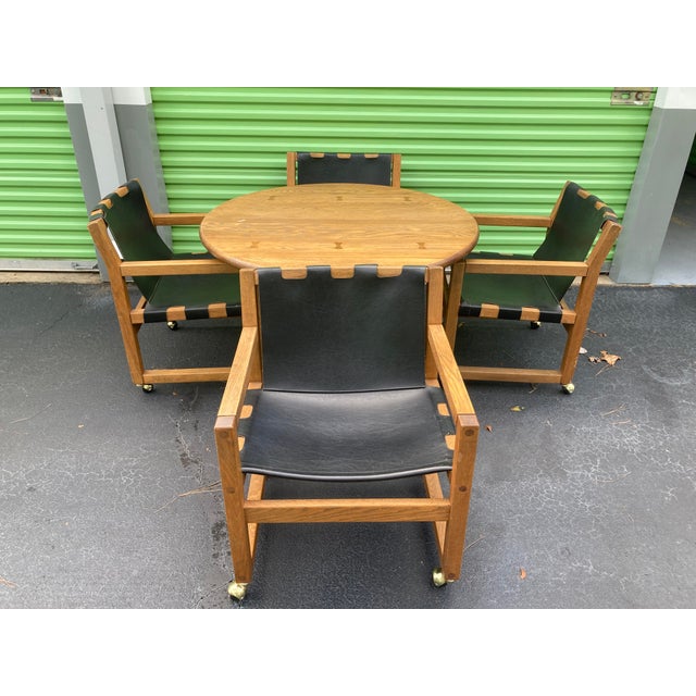 A rare and well preserved round dining table and four sling chairs by Russell Wright for Conant Ball. Most likely produced...
