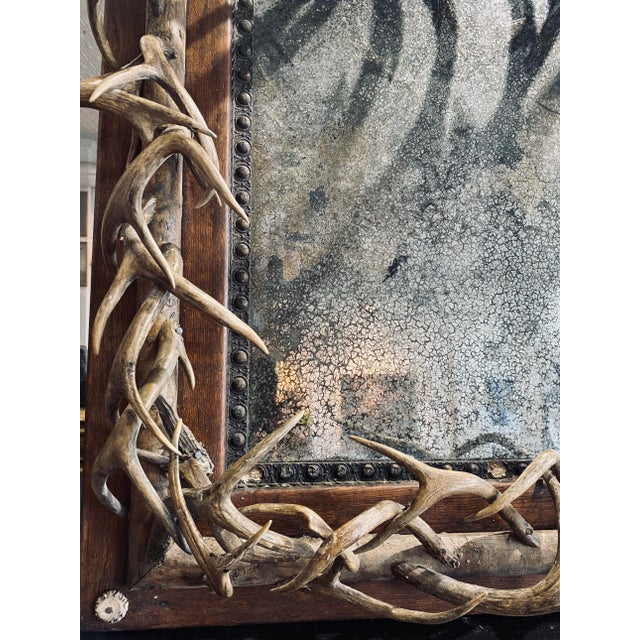 Beautiful antique German mirror adorned with Roe Deer Antlers from the Black Forest in Germany. Estimate time period...