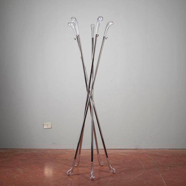 This exceptional garment rack (often called a "dead man") is an icon of modern antiques and 20th-century design. Featuring...