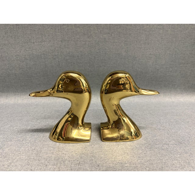 A pair of brass duck bookends by Virginia Metalcrafters. The solid brass bookends are a good weight to hold up a book...