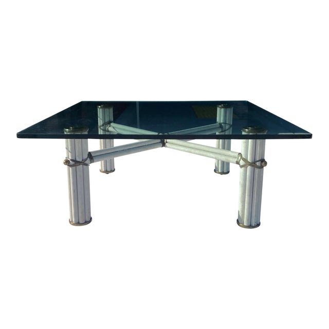 Faux bamboo tube steel, brass capped, brass banding, and trim coffee table with heavy 3/4” thick square glass top, manner...