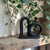 Elevate your home decor with the Modern Matte Black Ceramic Looped Bud Vase, a striking piece that seamlessly blends...