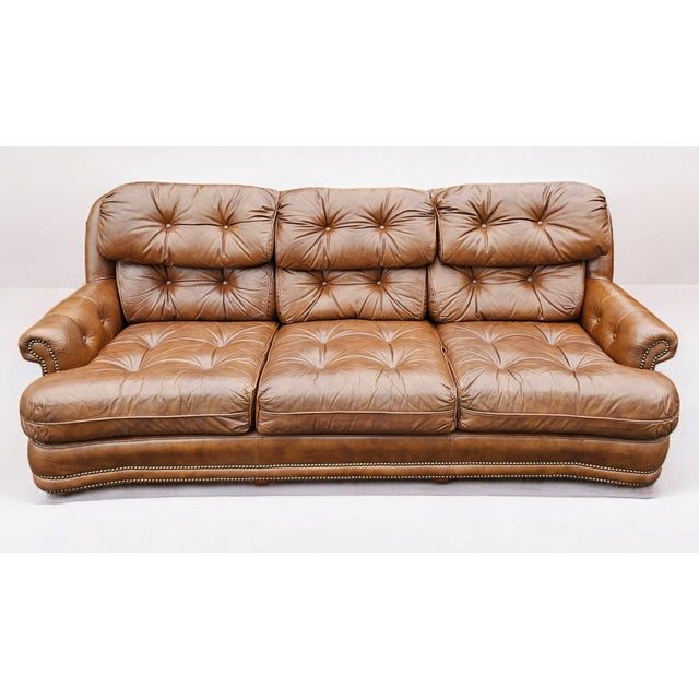Classic Leather's Vintage 1982 Leather Chesterfield Sofa is a magnificent furniture masterpiece that has elegantly aged to...