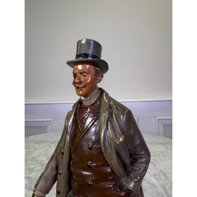A stellar find for collectors of fine Turn-of-the-Century European ceramics, this antique polychrome terracotta sculpture...