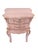 A beautifully restored French nightstand in a soft, romantic pink with a gently distressed finish. This piece features...