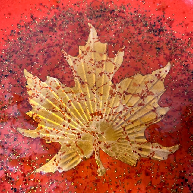 Beautiful decorative enamel bowl by Curtis Jere for Artisan House. It is black enamel on the outside and red on the inside...