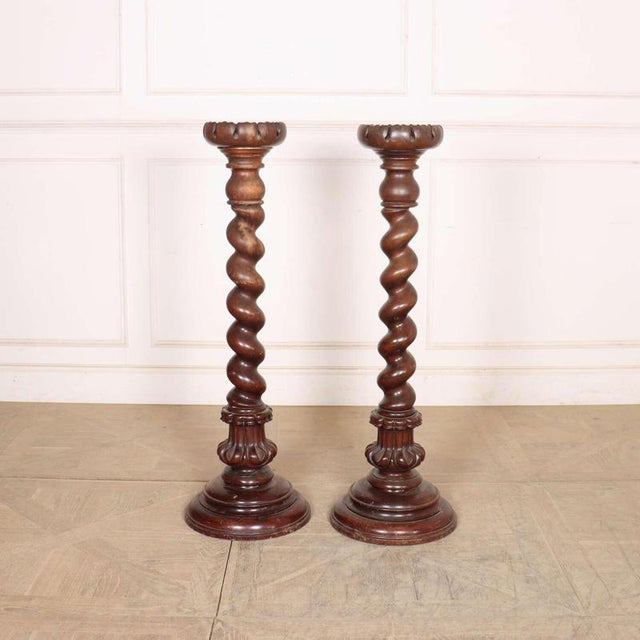 Good pair of large 19th century German twisted walnut candle stands. 1860. Will hold a 6-inch diameter candle. This piece...