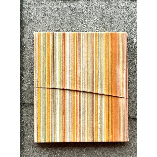 Infuse your space with warmth and texture with "Orange Stripe," a one-of-a-kind pleated abstract oil painting. The...