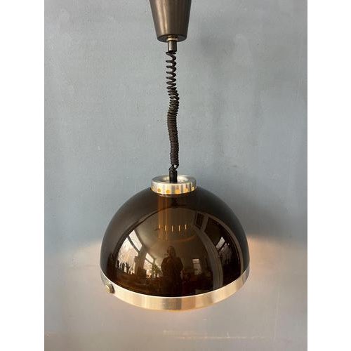 Vintage space age pendant lamp by dijkstra. The piece has a an acrylic glass dome with a metal frame underneath. The...