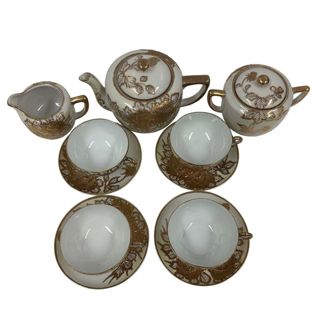 Lovely delicate gold on white hand gilded Tea Service for 4. This tea service set is very old and still very beautiful!...