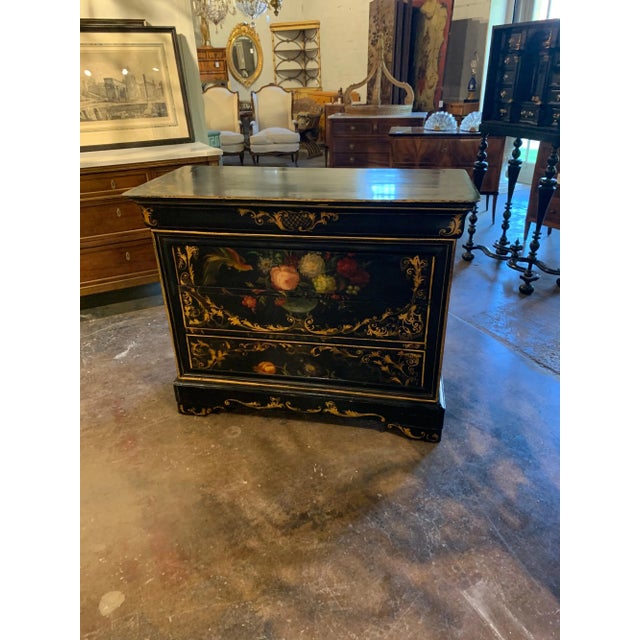 Beautiful 19th century French black lacquered Louis Philippe commode. Featuring a lovely hand painted design including...