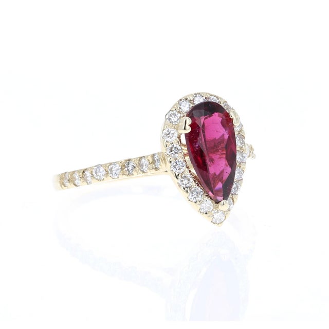 1.63 Carat Tourmaline Diamond 14K Yellow Gold Engagement Ring. This stunning piece has a beautiful Pear Cut Red Tourmaline...