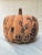 A single pumpkin or gourd shaped ceramic sculpture with matte terracotta color and hand painted blue chinoiserie landscape...