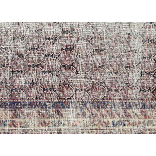 19th Century Persian Shiraz Rug. Hand woven in the Hamadan region of Iran. Distressed and refinished in the U.S. The...