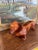This vintage Hull Pottery dachshund planter features a sleek mid-century design with a warm brown-to-orange glaze,...