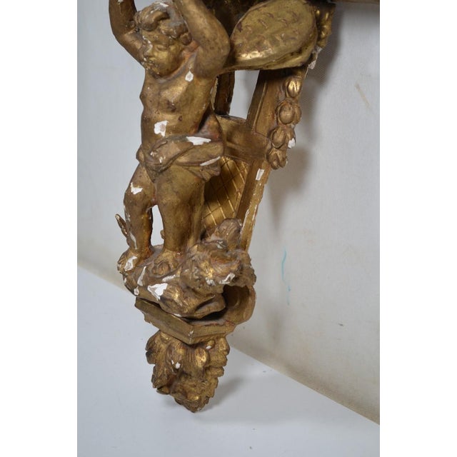 Gold France XVIIIth Century Small Wall Bracket in Stuccoed and Gilded Wood, the Scalloped Top Supported by Zéphir For Sale - Image 8 of 13