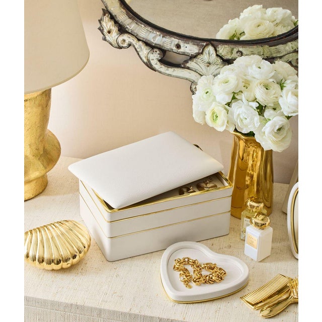 A luxurious heart-shaped tray covered in Italian velvet, further enhanced with brass edging. It looks beautiful on a desk...