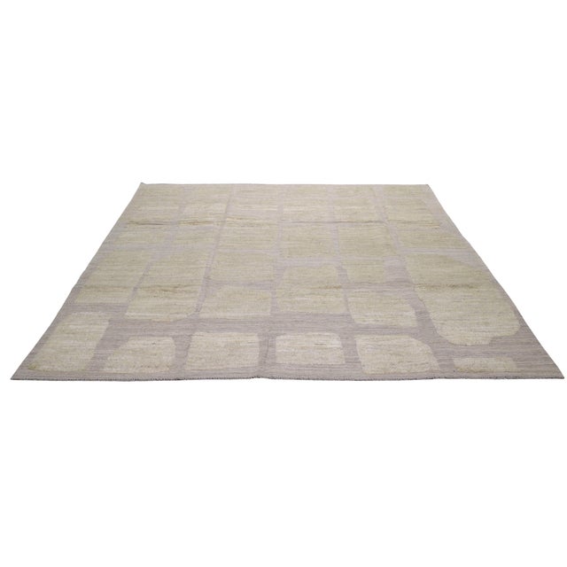 Moroccan Hand-knotted with care using traditional rug-making techniques, this wool rug blends timeless craftsmanship with...