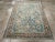 This mid-20th-century Persian Malayer accent rug presents a balanced floral composition across a soft blue field. Stylized...