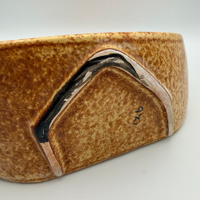 This vase dates from the 1970s and showcases the typical organic-abstract design language of Italian ceramics of that era....