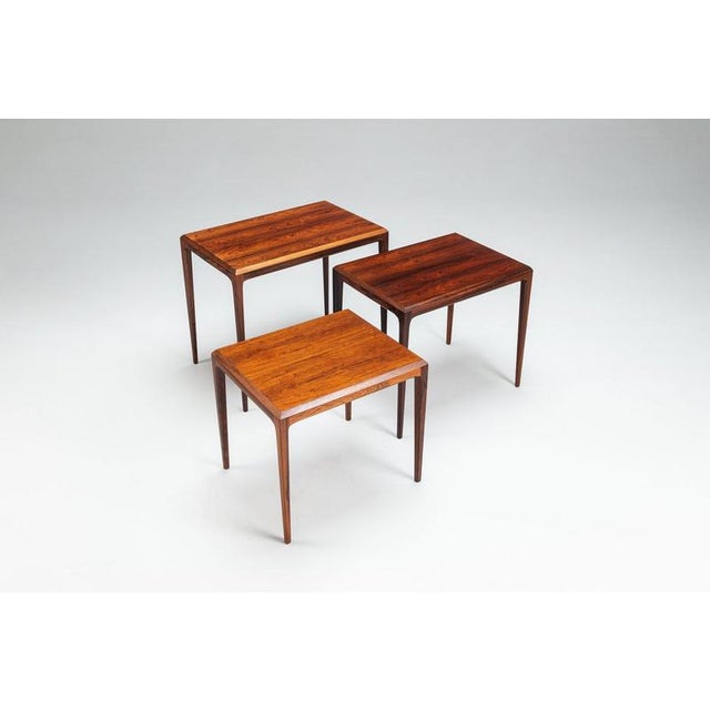 Set of three johannes andersen nesting tables in santos rosewood, produced by cfc silkeborg møbelfabrik, denmark, 1960s. A...