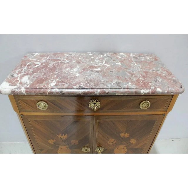 Small Louis XV-Louis XVI Transition style inlaid in-between buffet in Fruit Wood. Its top is covered with original red...