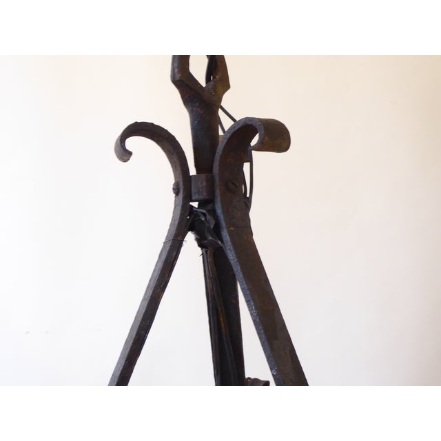 This wrought iron chandelier with old patina, has 6 lights and uses up to 60 Watt Edison base bulbs.