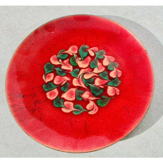 Copper enamel shallow tray in bright red enamel with a center design of heart drops pulled into flowing paisleys....