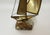 A striking vintage mid-century modern sailboat sculpture featuring gracefully curved brass-toned metal sails, delicate...