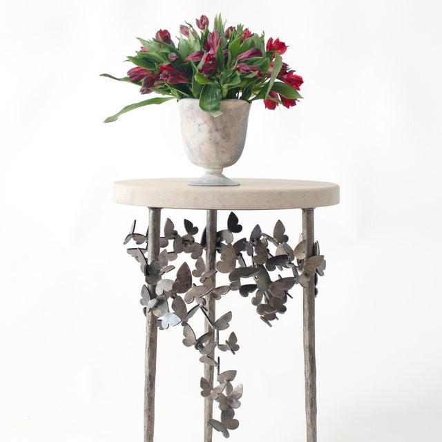 Embrace the delicate beauty of the Butterfly Accent Table, an enchanting piece that flawlessly marries form and function....