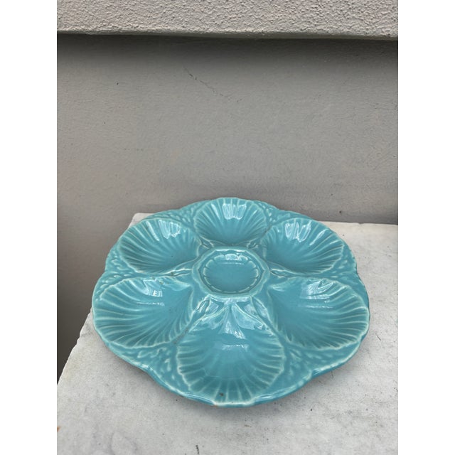 French aqua turquoise Majolica oyster plate signed Sarreguemines, circa 1890. 6 shells and space for the lemon on the center.