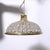 Pendant light, featuring a brass dome structure decorated with numerous faceted crystal gems. Inside, another beautiful...