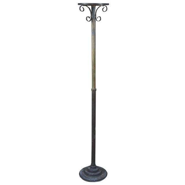 Vintage adjustable telescoping candle holder or plant stand. Made of iron and brass featuring scrolled accents.
