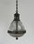 - a wonderful and rare teardrop caged holophane pendant with original chain and ceiling rose, france circa 1920. - the...