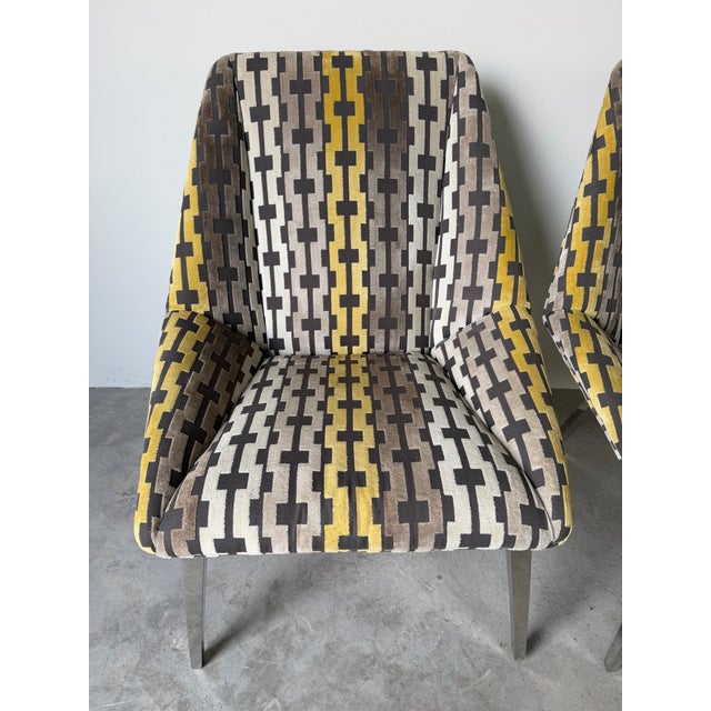 Stylish pair of vintage Thayer Coggin lounge chairs featuring bold geometric patterned fabric upholstery in shades of...