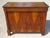 A 19th-century buffet with two doors and one drawer, featuring a curved top. Magnificent marquetry top with chevron and...