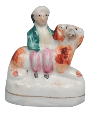 19th Century Small Staffordshire Pottery Boy Seated On Recumbent Spaniel Dog Figurine