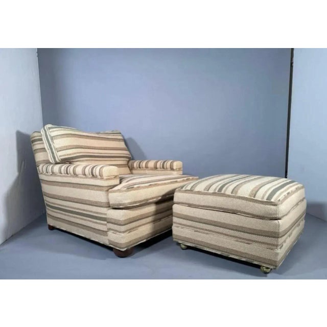 Midcentury large scale upholstered armchair and ottoman, in the style of Jean Michel Frank, circa 1950. Armchair has a...