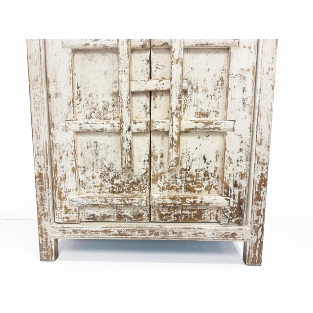 Handcrafted Tall Cabinet made from reclaimed timber, sourced from antique doors and windowsills found in remote Chinese...