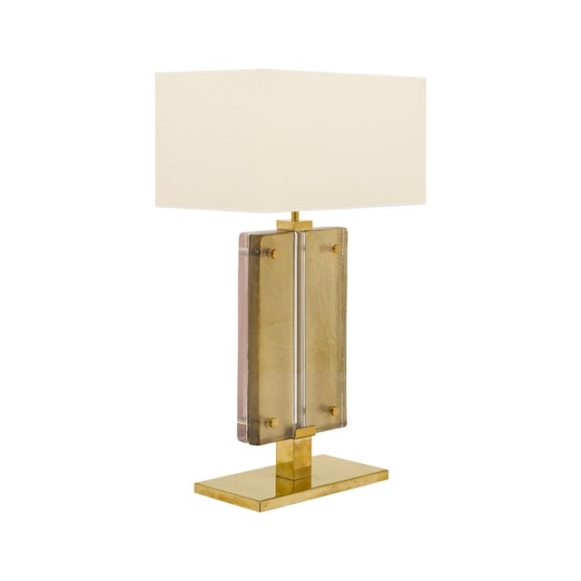Single lamp from the island of Murano outside of Venice, Italy. Slabs of hand-blown glass are supported by a solid brass...