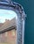 An elegant 1960s French Louis XVI–style full-length mirror, handcrafted with a richly carved wood frame and finished in a...