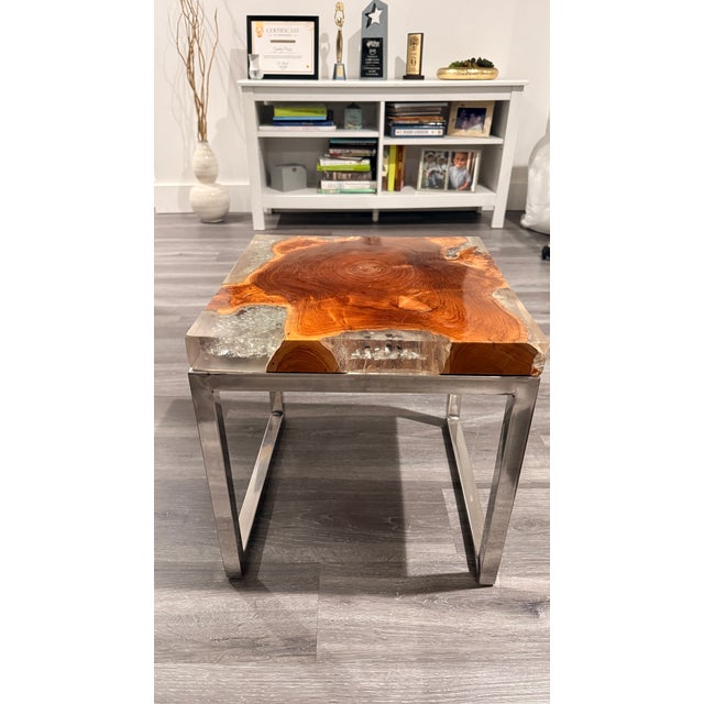 Beautiful one-of-a-kind handcrafted statement tables featuring stunning natural wood grain, crystal-clear resin and sleek...