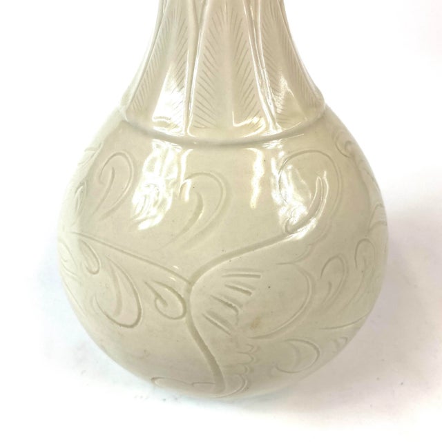This porcelain vase is Song-style with a unique lotus top