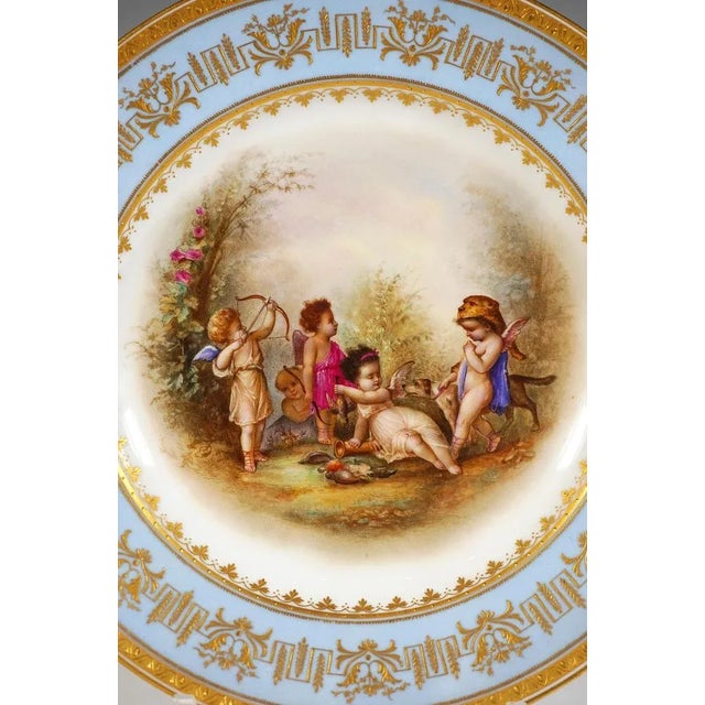 Porcelain picture plate with fine polychrome painted scenery: In the mirror five winged cupids dressed as hunters with dog...