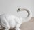 LARGE MID CENTURY MAJOLICA DINOSAUR SCULPTURE A rare and extremely decorative model depicting a Brontosaurus with curved...