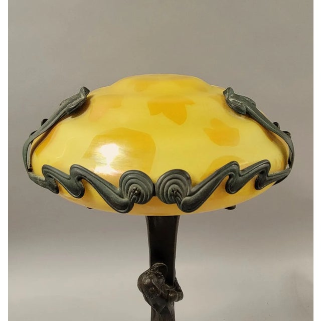 Striking Austrian-style Art Nouveau table lamp in the manner of sculptor Gustav Gurschner (1873–1970), featuring a...