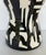 Original retail $1100, stylish Global Views Abstract Modern Black and White Stool, showroom floor sample