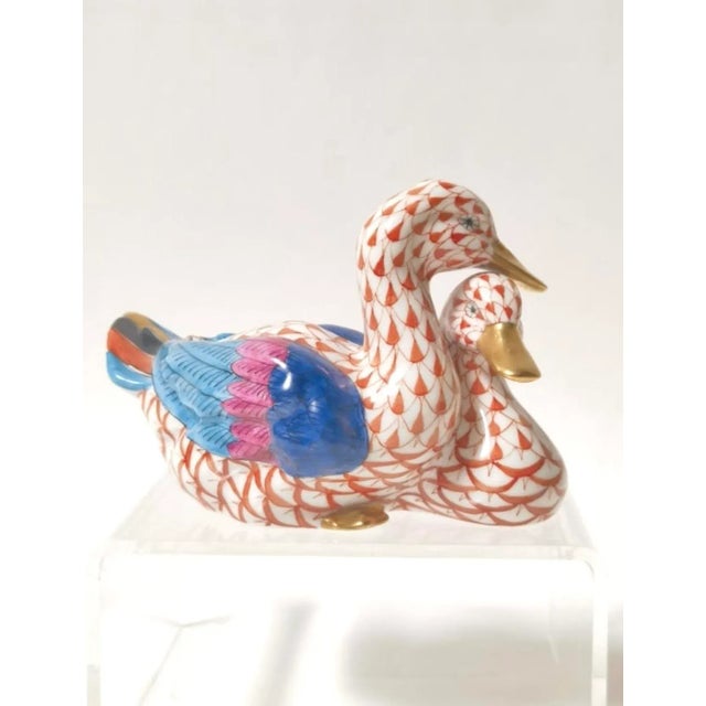 Exquisite Herend Hungary porcelain figurine featuring a pair of Mandarin ducks hand-painted in the iconic rust red fishnet...