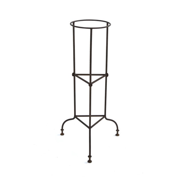 Unique industrial metal tripod base plant stand. May have had some original industrial purpose in the past, but now works...