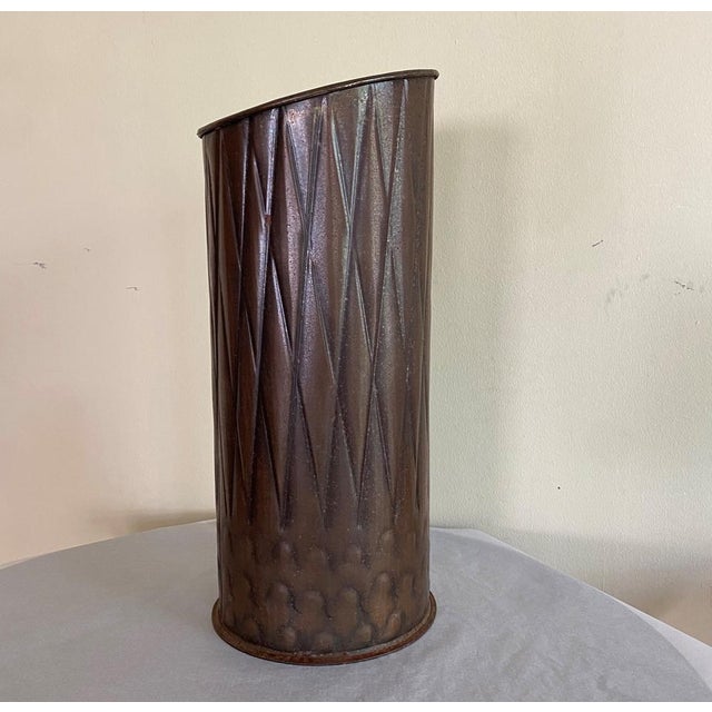Vintage copper or copper plated umbrella stand This piece is designed in the style of the selected designer and/or...